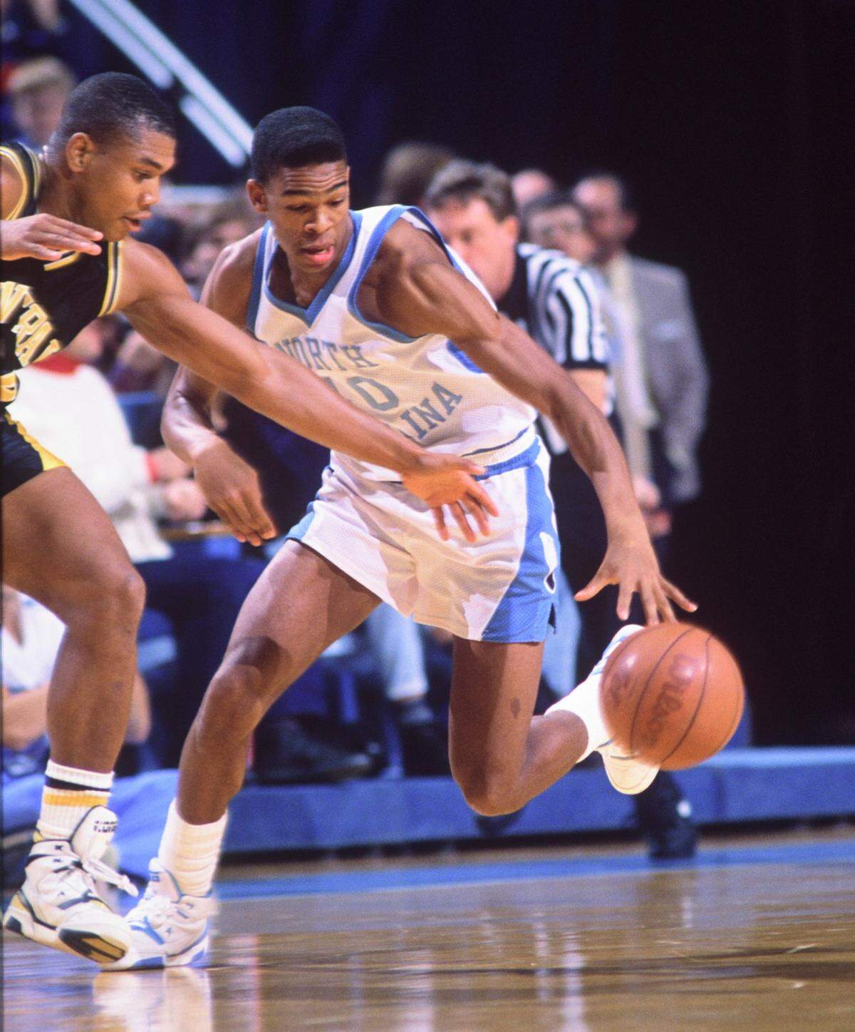 UNC's Hubert Davis makes a steal during his playing days for the Tar Heels in the early 1990's.