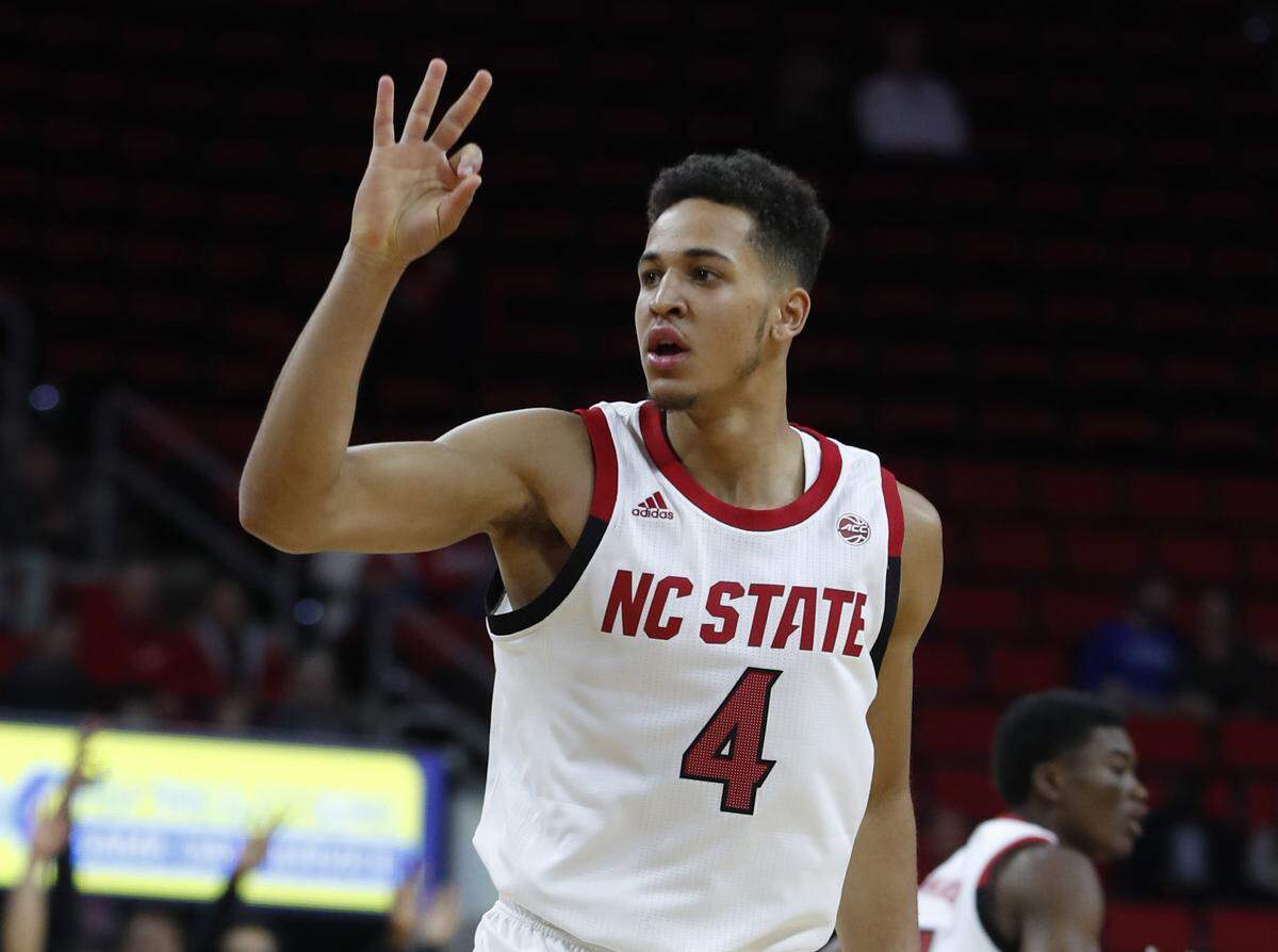 N.C. State’s Jericole Hellems (4) celebrates making a three-pointer during the first half of N.C. State’s exhibition game against Chowan at PNC Arena in Raleigh, N.C., Monday, Oct. 29, 2018.