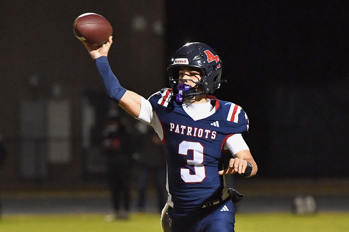 Apex Friendship quarterback Tyler Goebbel (13) passes downfield against Rolesville during the first half. The Apex Friendship Patriots and the Rolesville Rams met in  the second round of the  NCHSAA 8A Playoff game in Apex, N.C. on November 14, 2025. Rolesville wins 14-7 in overtime.