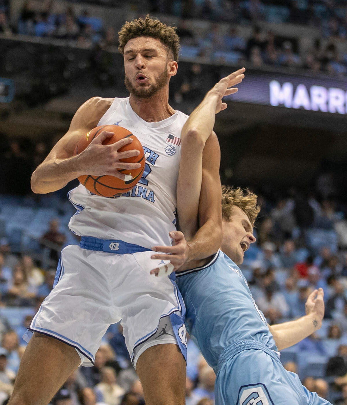 North Carolina’s Pete Nance (32) secures an offensive rebound against The Citadel’s Stephen Clark (1) in the first half on Tuesday, December 13, 2022 at the Smith Center in Chapel Hill, N.C.