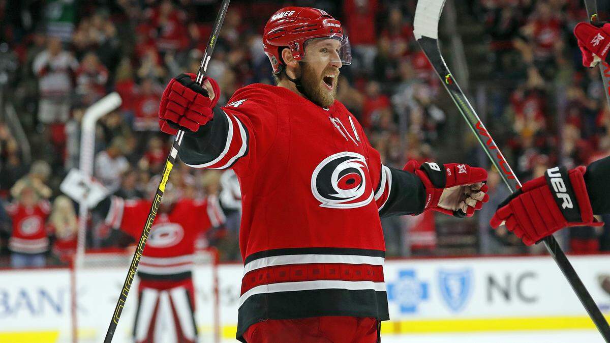Carolina Hurricanes’ Jaccob Slavin (74) celebrating an overtime goal against Tampa Bay in October 2019, has won the 2020-21 Lady Byng Trophy.