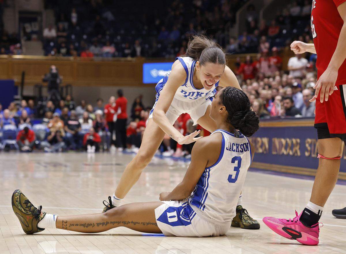 Duke’s Jordan Wood celebrates with teammate Ashlon Jackson after Jackson drew an and-one during the second half of the Blue Devils’ 83-65 win over N.C. State on Thursday, Feb. 19, 2026, at Cameron Indoor Stadium in Durham, N.C. 