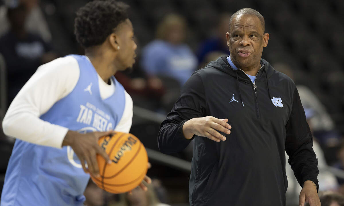 North Carolina coach Hubert Davis works with guard Jaydon Young (4) during the Tar Heels’ practice on Wednesday, March 18, 2026, at Bon Secours Arena in Greenville, S.C.