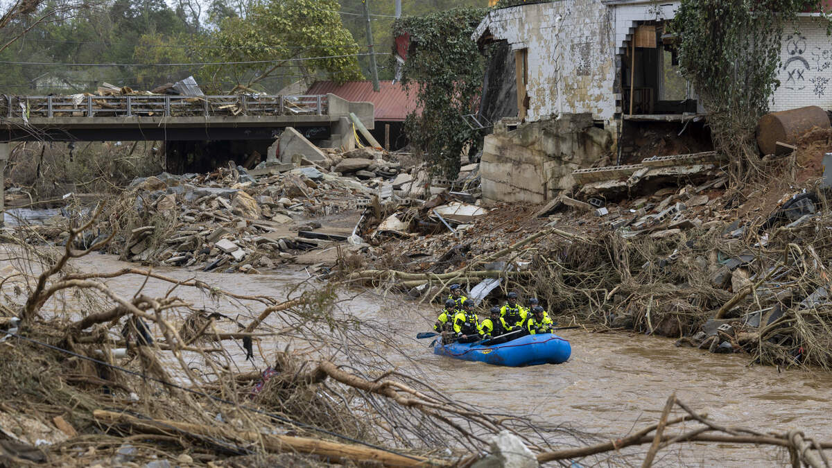 A rescue team paddles down the Swannanoa River on Sunday, Sept. 29, 2024. The remnants of Hurricane Helene caused widespread flooding, downed trees, and power outages in western North Carolina.