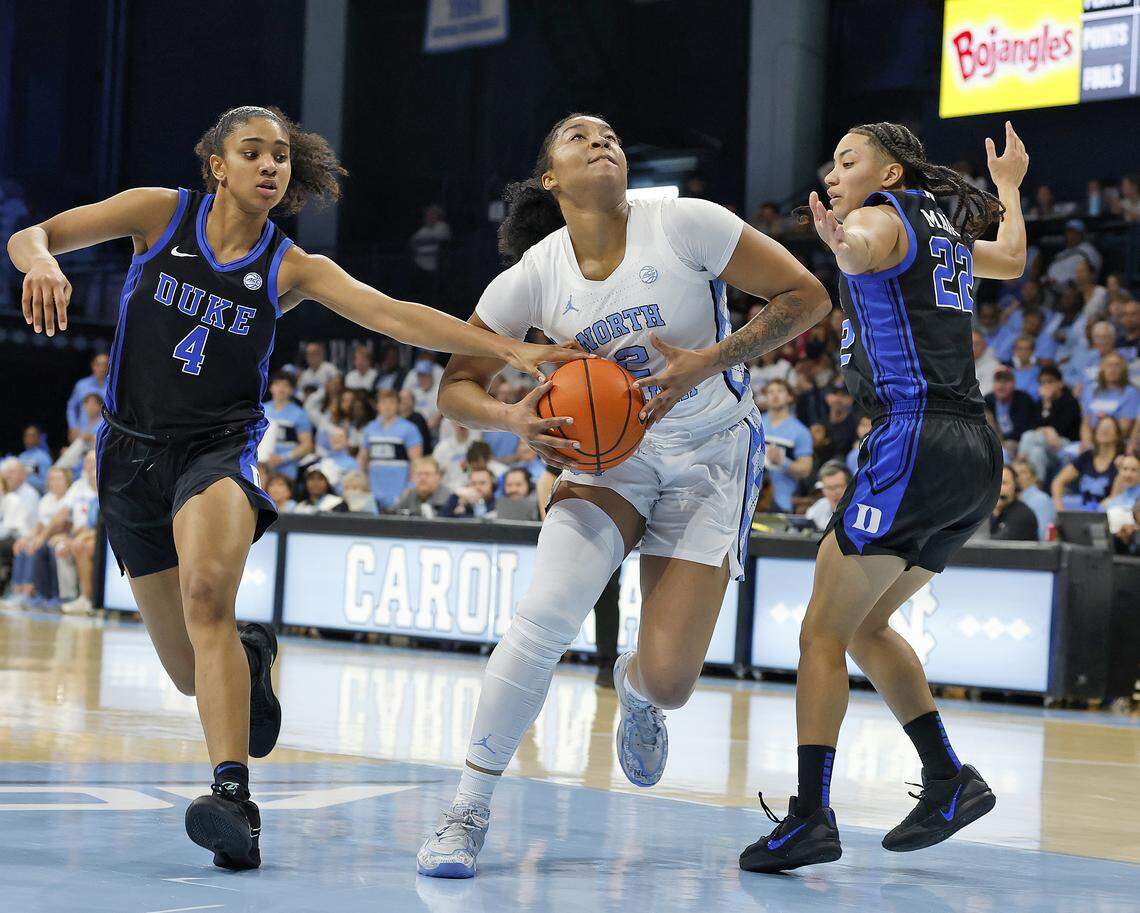 North Carolina’s Nyla Harris drives between Duke’s Riley Nelson and Taina Mair during the first half of the Tar Heels’ 74-69 win on Sunday, March 1, 2026, at Carmichael Arena in Chapel Hill, N.C. 