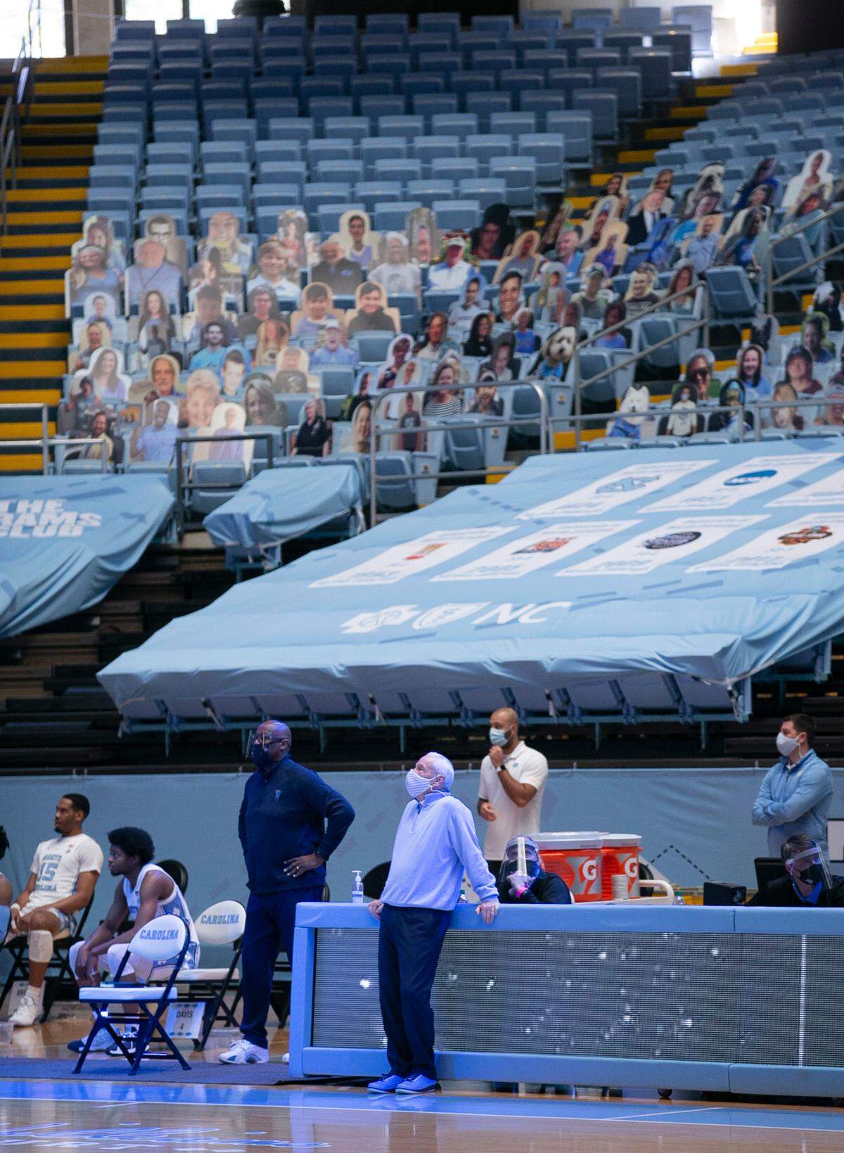 North Carolina coach Roy Williams watches a pre-game video prior to the tipoff of the Tar Heels’ game against N.C. State on Saturday, January 23, 2021 at the Smith Center in Chapel Hill, NC.