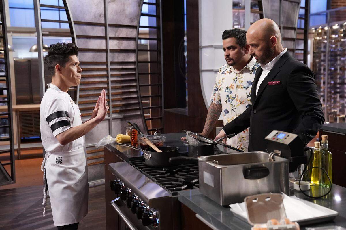 From left: Juni Cuevas, judge Aaron Sanchez and judge Joe Bastianich in the "World Cup Dishes" episode of "MasterChef" on Fox.