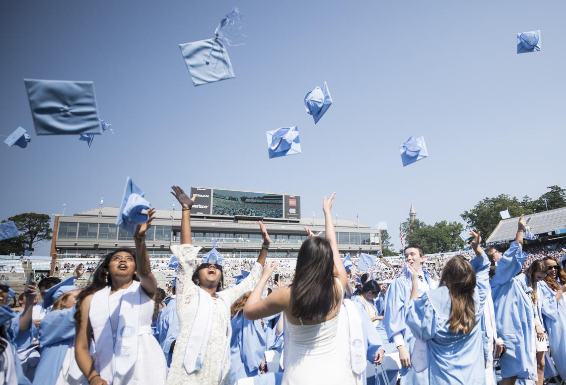Graduates toss their caps into the air to conclude to the 2018 spring commencement ceremony at UNC-Chapel Hill on Sunday, May 13, 2018.