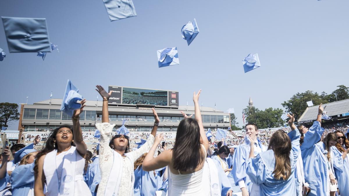 Graduates toss their caps into the air to conclude to the 2018 spring commencement ceremony at UNC-Chapel Hill on Sunday, May 13, 2018.