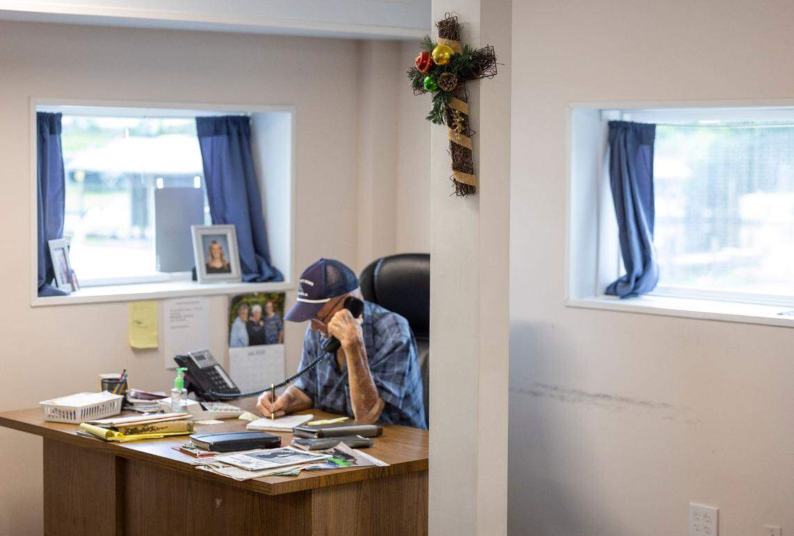 Tim Millis, age 93, still comes to the office to help with the family business, including by taking customers’ orders.