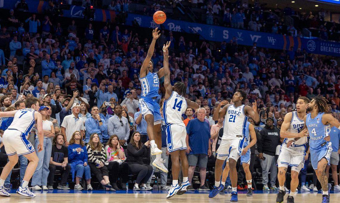 North Carolina forward Ven-Allen Lubin (22) launches a last second thee point shot, securing a 74-71 victory for Duke on Friday, March 14, 2025 during the semifinals of the ACC Tournament at Spectrum Center in Charlotte, N.C.