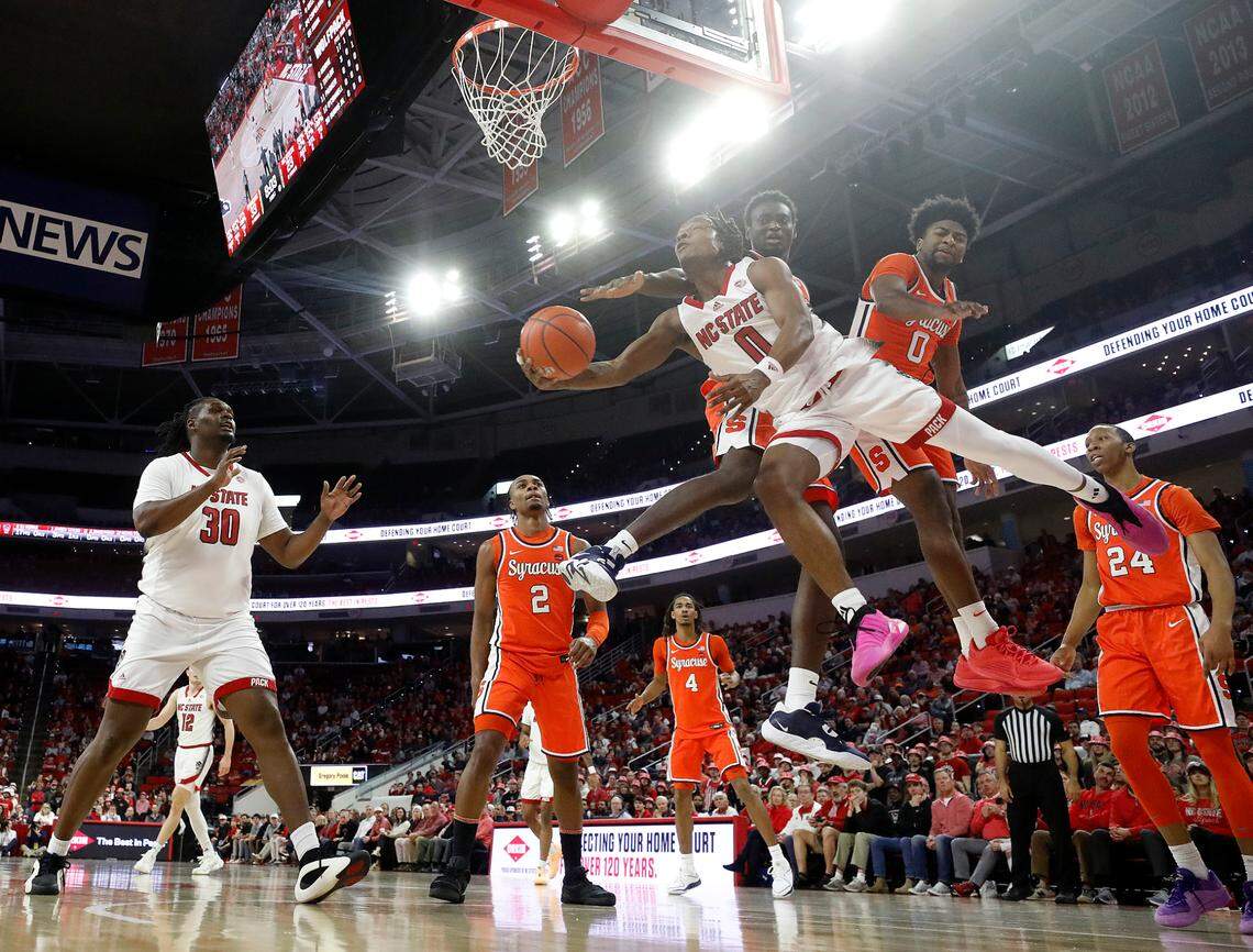 N.C. State’s DJ Horne drives to the hoop during the first half of the Wolfpack’s game against Syracuse on Tuesday, Feb. 20, 2024, at PNC Arena in Raleigh, N.C.
