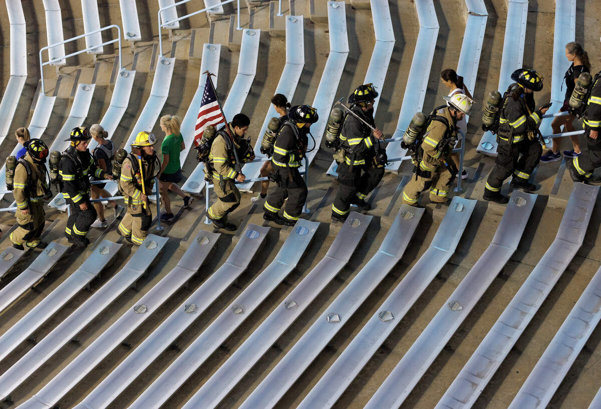 Participants climb the stairs of Kenan Memorial Stadium during an event in Chapel Hill, N.C. on Thursday, Sept. 11, 2025, to honor those who lost their lives during the attacks of Sept. 11, 2001.