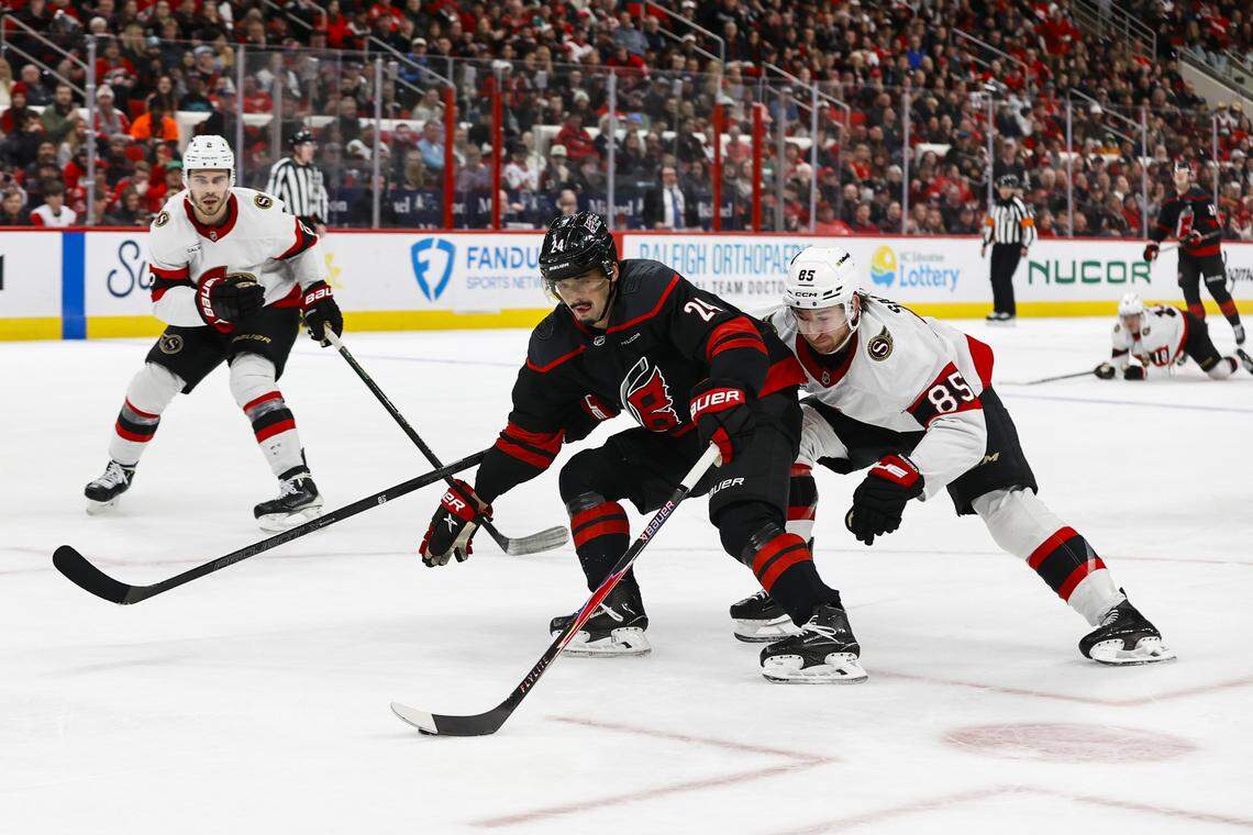 Seth Jarvis (24) of the Carolina Hurricanes skates with the puck against Jake Sanderson (85) of the Ottawa Senators during the second period at Lenovo Center on Feb. 3, 2026 in Raleigh, North Carolina.