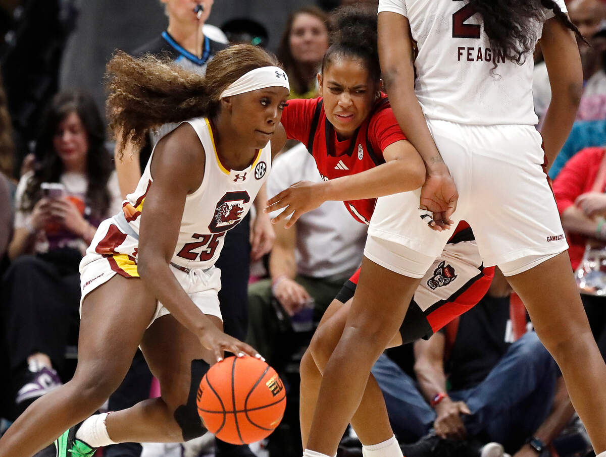 N.C. State’s Zamareya Jones fights through a screen by South Carolina’s Sania Feagin during the second half of the Wolfpack’s 71-57 loss on Sunday, Nov. 10, 2024, at Spectrum Center in Charlotte, N.C.