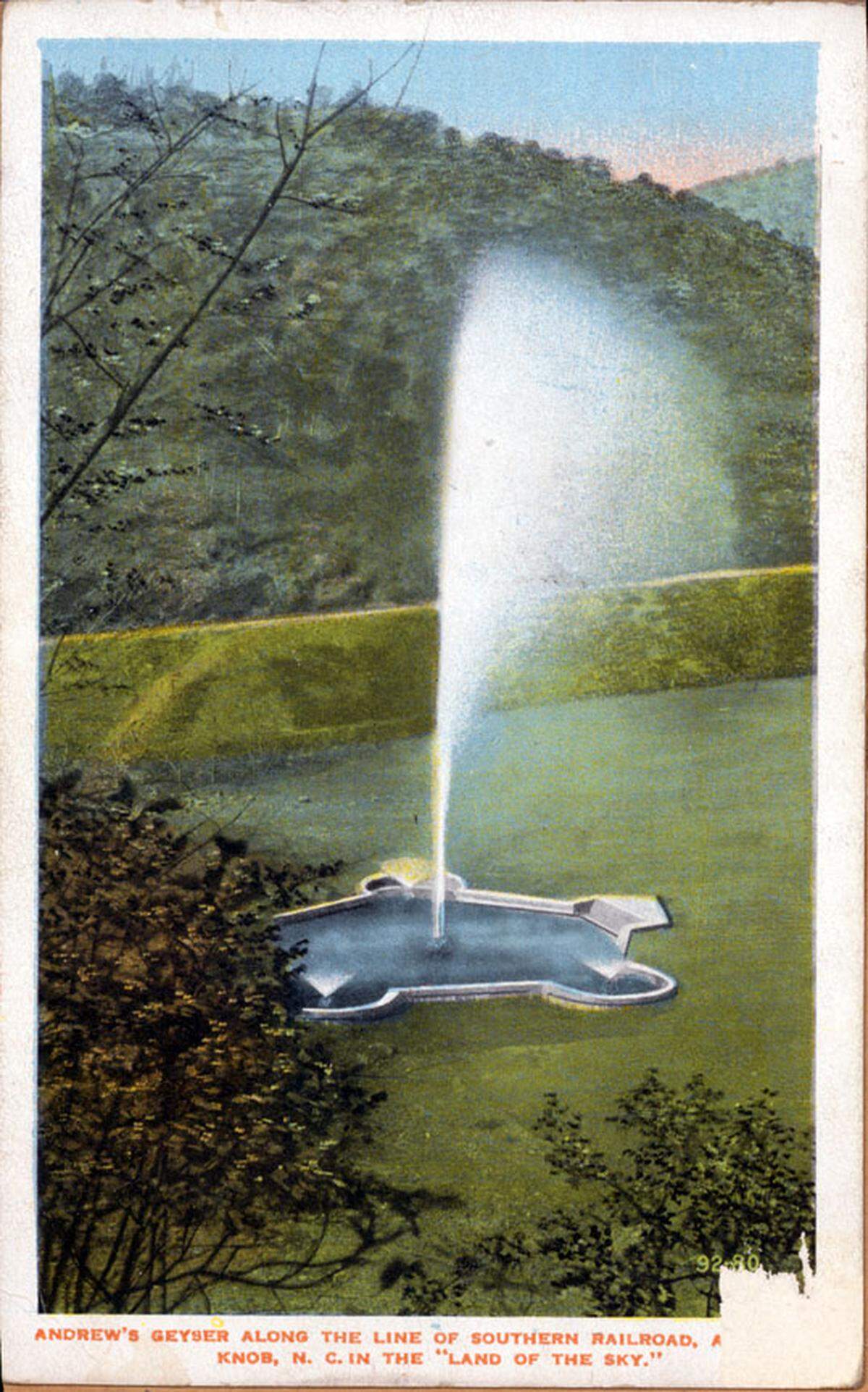 A colored postcard of Andrews Geyser after it had been moved and restored in 1911.