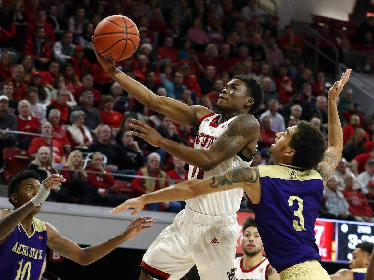 N.C. State’s Markell Johnson (11) drives past Alcorn State’s Corey Tillery (3) during the second half of N.C. State’s 87-64 victory over Alcorn State at Reynolds Coliseum in Raleigh, N.C., Tuesday, Nov. 19, 2019.