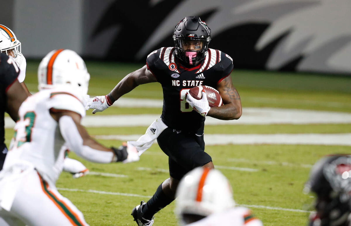 N.C. State running back Ricky Person Jr. (8) gains yards during the first half of N.C. State’s game against Miami at Carter-Finley Stadium in Raleigh, N.C., Friday, Nov. 6, 2020.