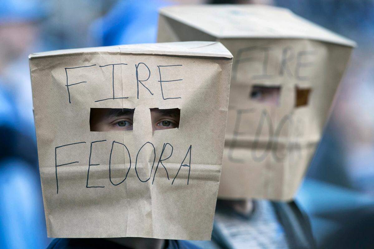 North Carolina students, who wanted to remain anonymous, covered their heads with paper bags to show their displeasure with football coach Larry Fedora, calling for him to be fired, during the Tar Heels’ game against Western Carolina on Saturday, November 17, 2018 at Kenan Stadium in Chapel Hill.