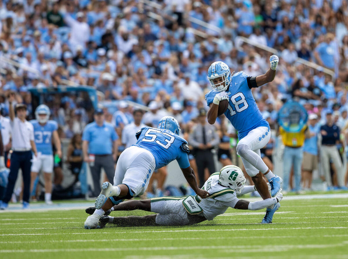 North Carolina tight end Bryson Nesbitt (18) picks up 11 yards after a pass reception from quarterback Conner Harrell (15) in the second quarter against Charlotte on Saturday, September 7, 2024 at Kenan Stadium in Chapel Hill, N.C.