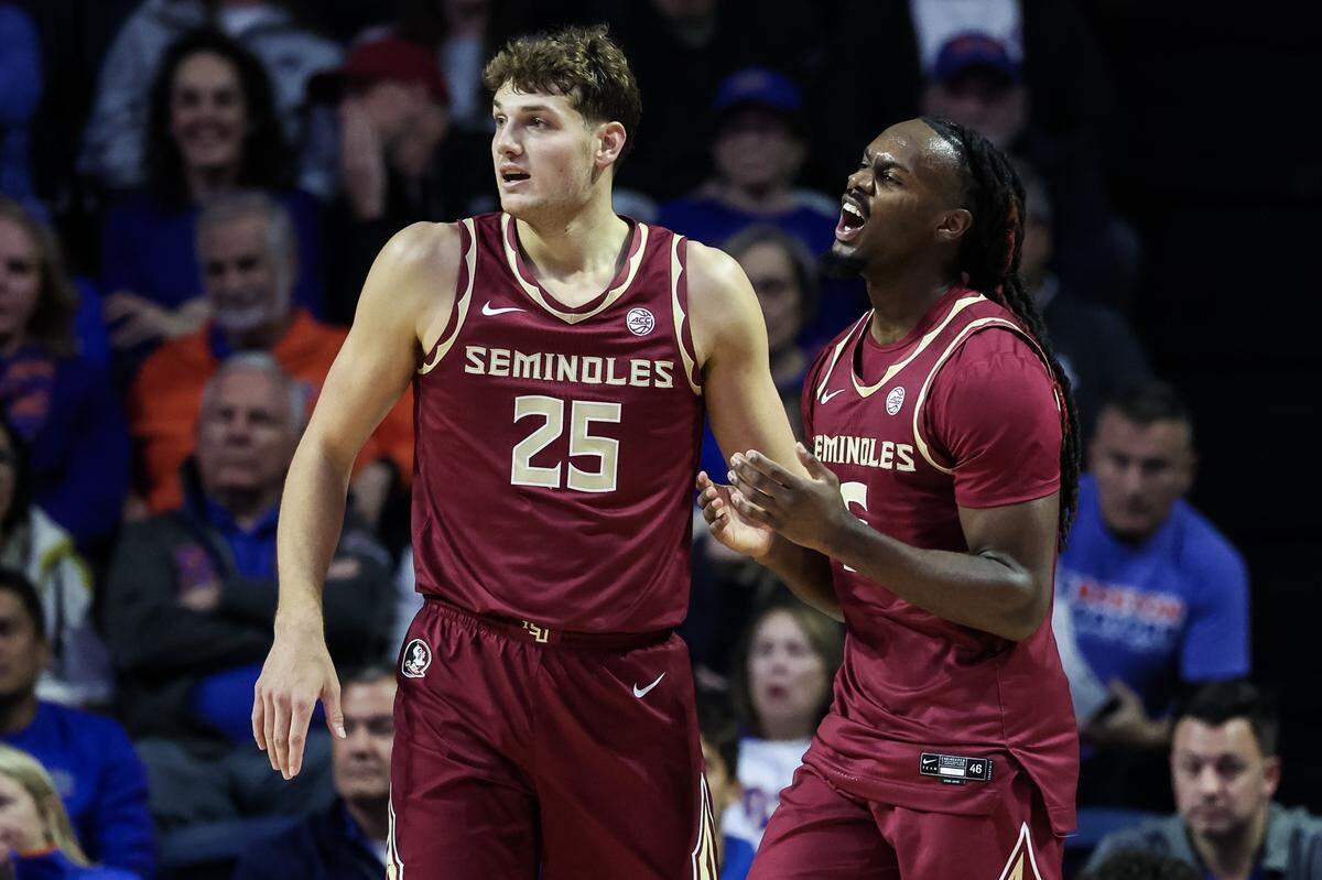 Robert McCray V, right, and Alex Steen (25) of the Florida State Seminoles react during their game against the Florida Gators on Nov. 11.