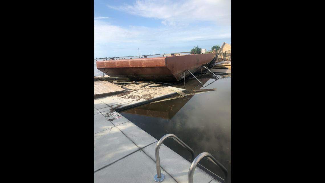A barge ended up in a swimming pool in Southport, North Carolina, during Hurricane Isaias. The town suffered extensive damage when the storm made landfall in nearby Ocean Isle Beach.