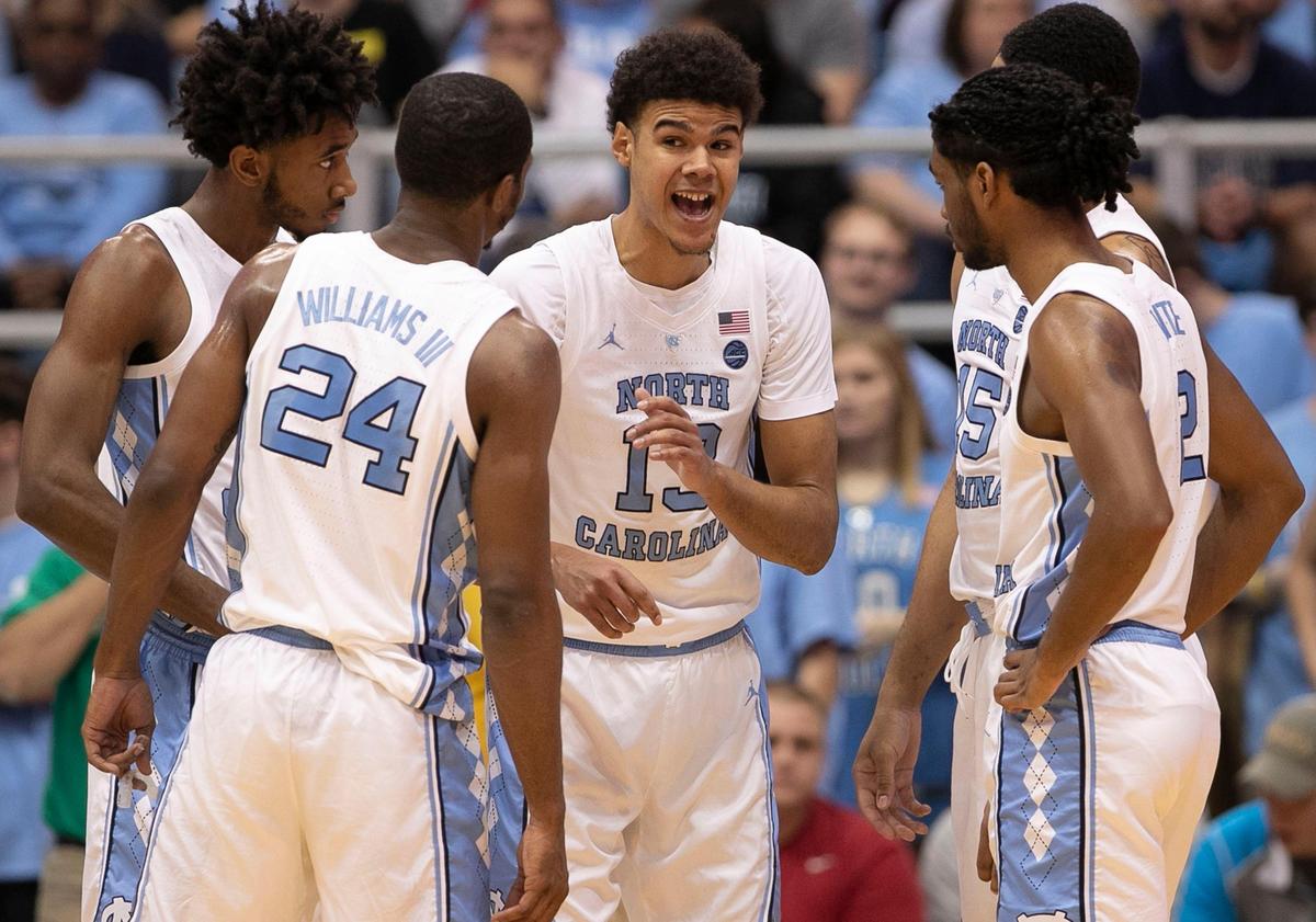 North Carolina’s Cameron Johnson (13) huddles with his teammates after a time out in the first half against Davidson on Saturday, December 29, 2018 at the Smith Center in Chapel Hill, N.C.