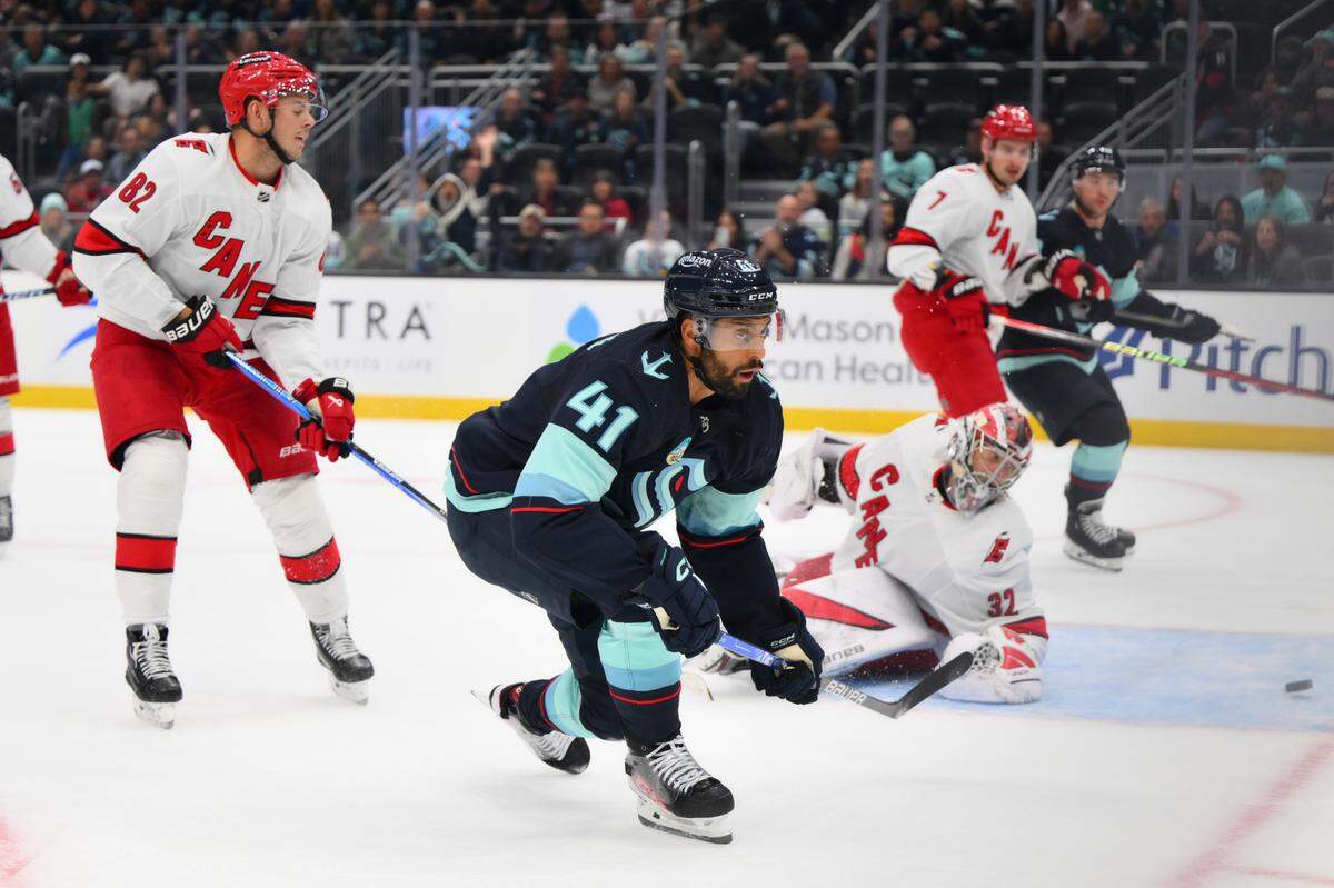 Seattle Kraken left wing Pierre-Edouard Bellemare (41) scores a goal past Carolina Hurricanes goaltender Antti Raanta (32) during the first period at Climate Pledge Arena on Thursday.