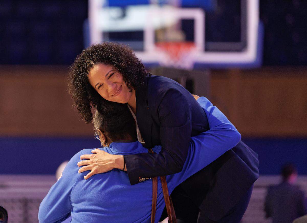 Duke women’s basketball head coach Kara Lawson gets a hug after being named the 2025-2028 USA Basketball Women’s National Team head coach during a ceremony at Cameron Indoor Stadium on Tuesday, Sept. 23, 2025, in Durham, N.C.