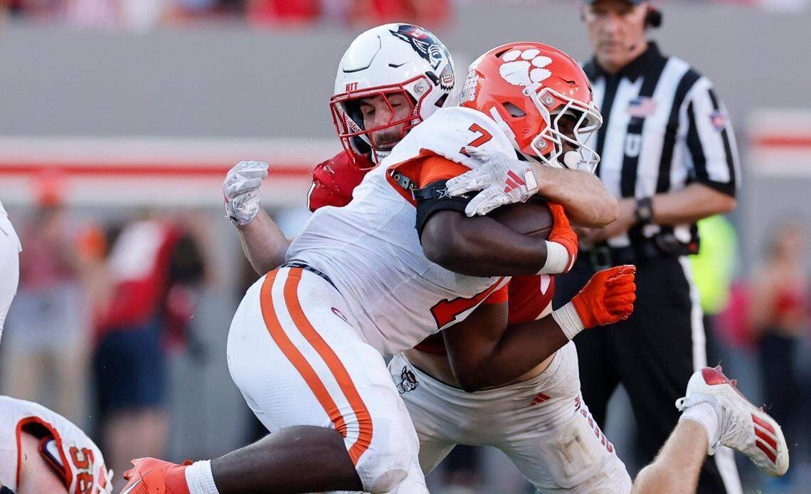 N.C. State linebacker Payton Wilson (11) tackles Clemson running back Phil Mafah (7) during the second half of N.C. State’s 24-17 victory over Clemson at Carter-Finley Stadium in Raleigh, N.C., Saturday, Oct. 28, 2023.