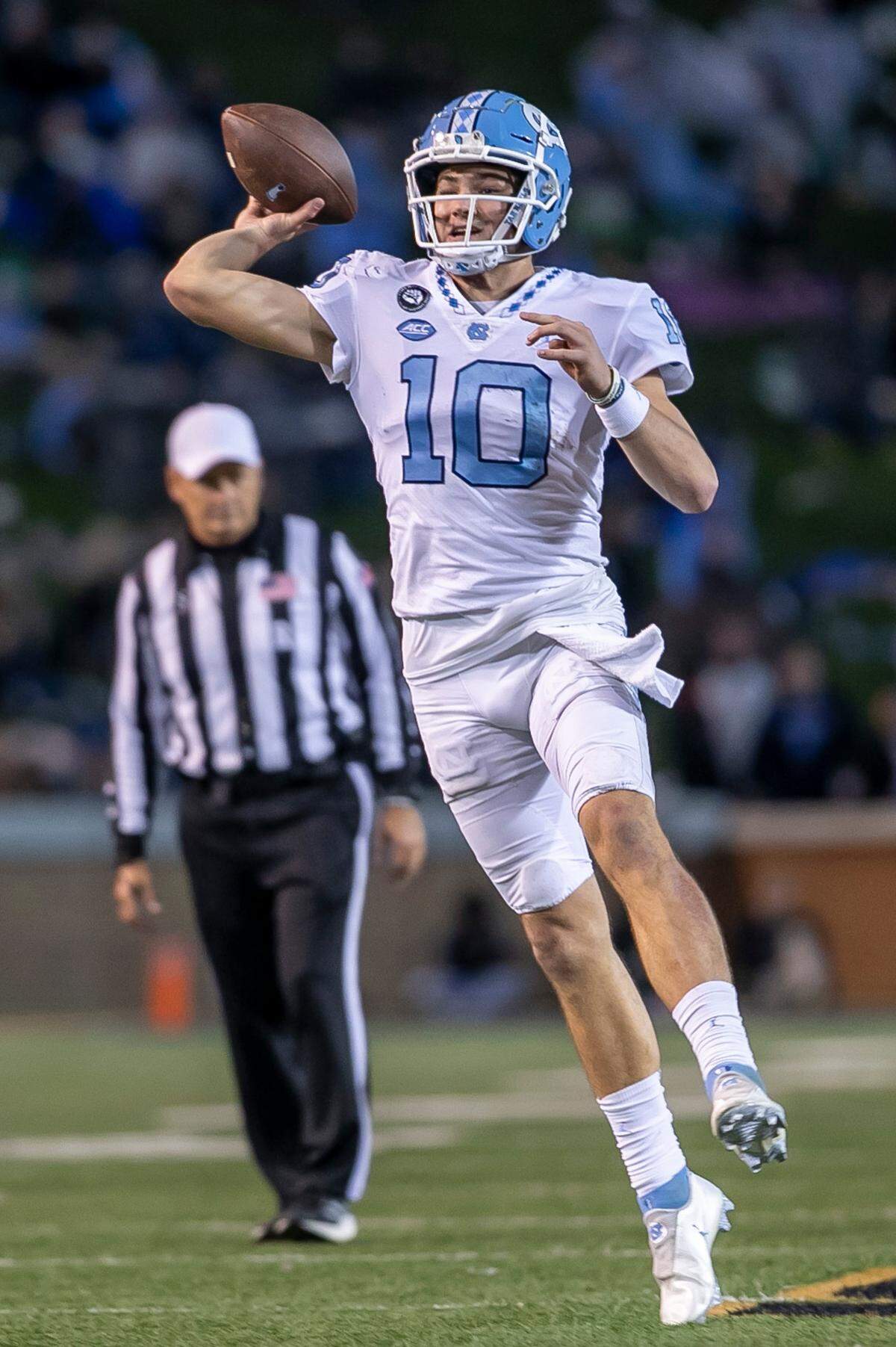 North Carolina quarterback Drake Maye (10) looks for an open receiver against Wake Forest on Saturday, November 12, 2022 at Truist Field in Winston-Salem, N.C. Maye passed for 448 yards and three touchdowns in the Tar Heels’ victory.