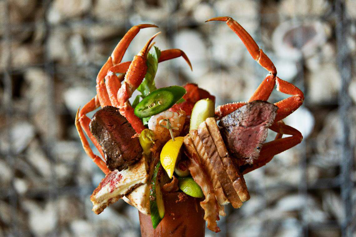 Zeus is one of Ultimate Bloody Mary’s on the cocktail menu at The Blind Pelican in Holly Springs. It includes shrimp, bacon, grilled cheese, lobster tail, a full pound of crab legs, a 6oz. filet mignon and oysters.