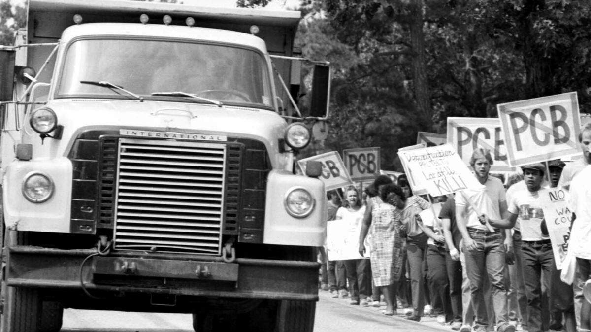 Protesters march in Warren County, NC in 1982 after a landfill for PCB’s was placed near the community of Afton. Trucks belonging to the Ward Transformer Company deliberately released toxic chemicals called PCBs along 250 miles of North Carolina roadways. Once uncovered, the waste had to be collected and contained.