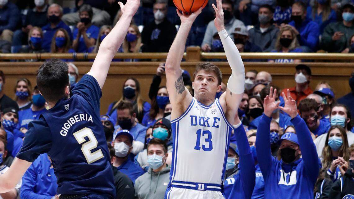 Duke’s Joey Baker (13) shoots a three-pointer as Georgia Tech’s Saba Gigiberia (2) defends during the first half of Duke’s game against Georgia Tech at Cameron Indoor Stadium in Durham, N.C., Tuesday, January 4, 2022.