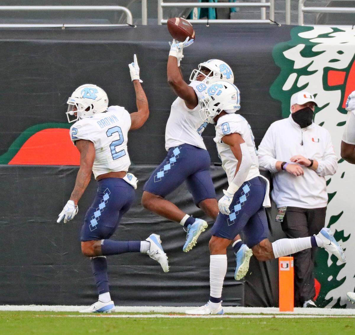 North Carolina Tar Heels running back Michael Carter (8) celebrates a first quarter touchdown as they play the Miami Hurricanes at Hard Rock Stadium In Miami Gardens, Florida, Saturday, December 12, 2020.