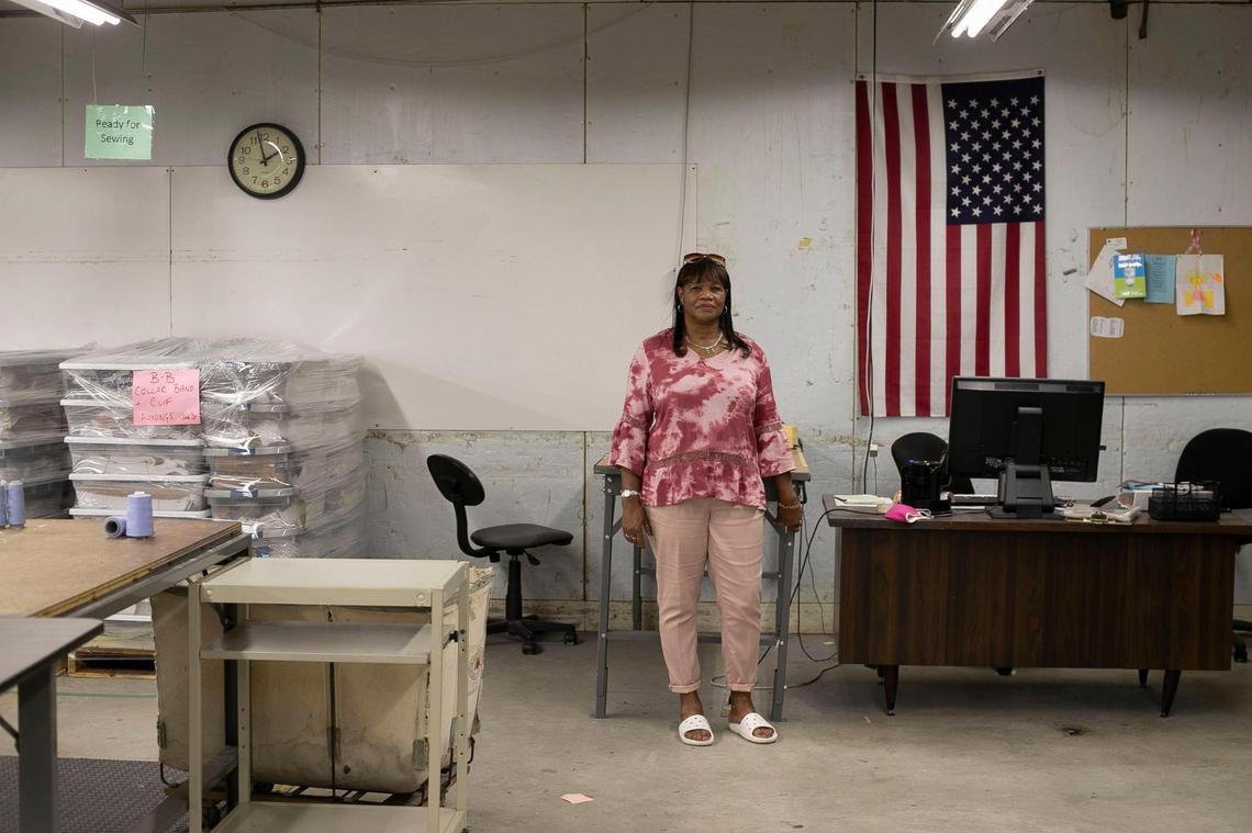 Katie Herring has worked since 1986 at the Garland Shirt Company in Garland, N.C. For the last 18 years Brooks Brothers has operated the factory and Herring has handled clients like President Trump, Kobe Bryant and the Jonas Brothers. Herring poses for a portrait on Thursday, July 16, 2020 in the nearly empty factory as they prepare to close their doors next week.