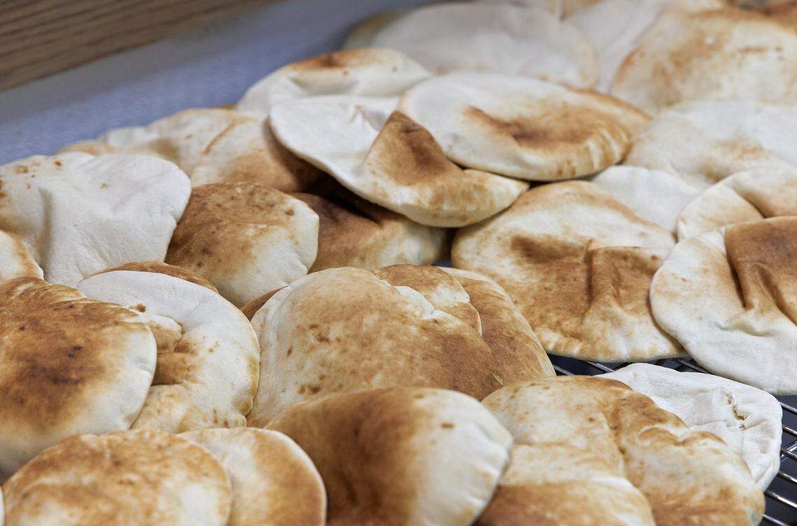 Pita bread is prepared at Mediterranean Deli on Thursday, Sept. 4, 2025, in Chapel Hill, N.C. 