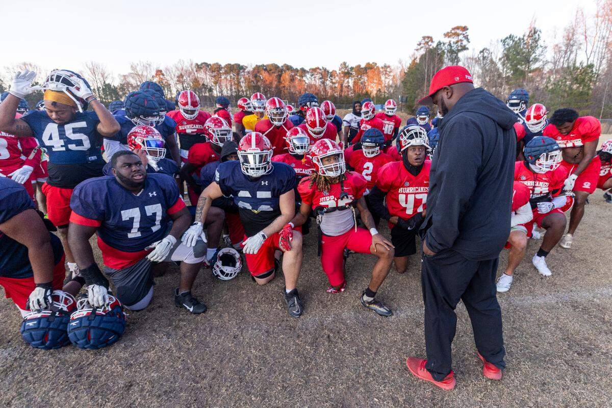 Louisburg College Head Football Coach Quinderra Spellman leads his team during their final practice on Tuesday, Dec. 3, 2004, in Louisburg. The team is heading to the NJCAA National Championship for the first time in the program’s 20-year history.