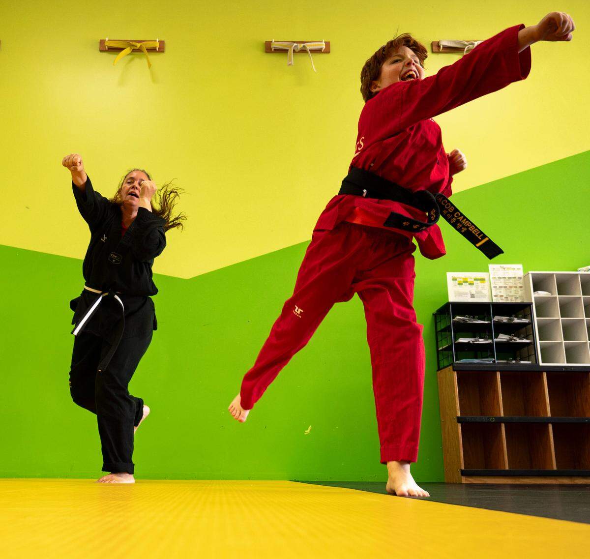 Laura Campbell and her 9-year-old son Jacob practice taekwondo at Master Chang’s Martial Art Studio in Durham, N.C. on June 4, 2024. Laura has enjoyed having a space where she can work towards a goal with her sons.