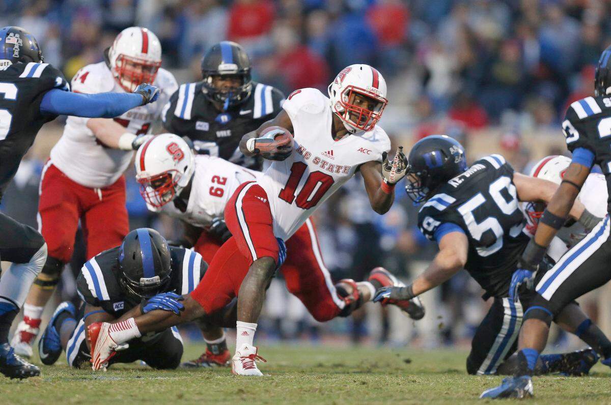 In this 2013 file photo, N.C. State running back Shadrach Thornton (10) scrambles for yards during the Wolfpack’s game against the Blue Devils at Wallace Wade Stadium in Durham, N.C., Saturday, November 9, 2013. 