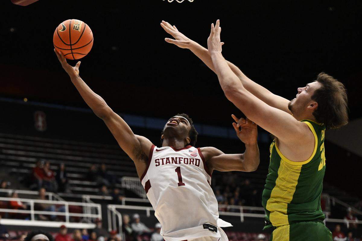 Ebuka Okorie (1) of the Stanford Cardinal goes up for a layup against Nate Bittle of the Oregon Ducks in the second half at Stanford Maples Pavilion on Oct. 30, 2025 in Palo Alto, California.