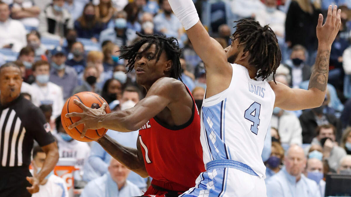 N.C. State’s Dereon Seabron (1) looks to get around North Carolina’s RJ Davis (4) during the first half of UNC’s game against N.C. State at the Smith Center in Chapel Hill, N.C., Saturday, Jan. 29, 2022.
