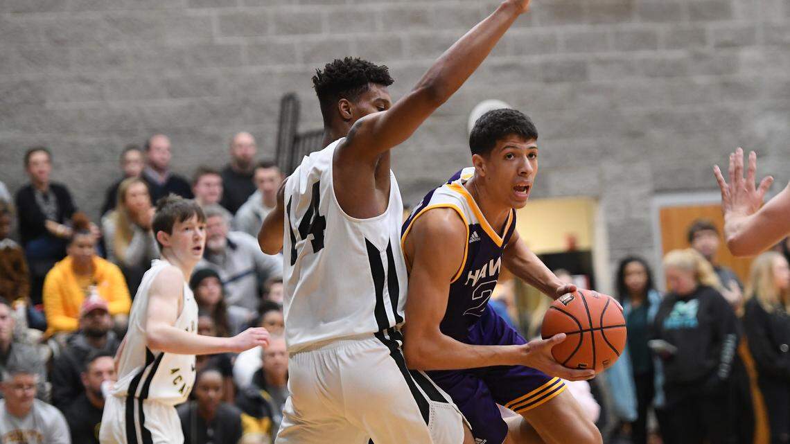 Kadin Shedrick, right, of Holly Springs dribbles against Isaiah Todd, left, of Trinity Academy. The Trinity Academy Tigers played the Holly Springs Golden Hawks in a high school basketball game that was part of the Phenom Hoops City of Oaks Showcase in Raleigh, N.C. on January 12, 2019.