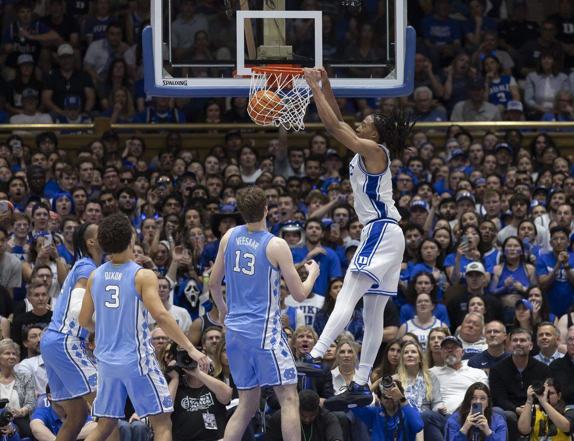 Duke forward Maliq Brown (6)  dunks over North Carolina forward jarin Stevenson (15), center Henri Veesaar (13) and guard Derek Dixon (3) in the second half on Saturday, March 7, 2026 at Cameron Indoor Stadium in Durham, N.C.