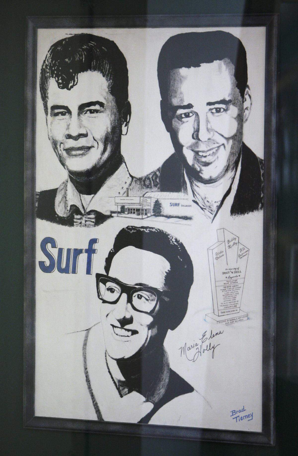A poster showing Buddy Holly, Ritchie Valens and J.P. “The Big Bopper” Richardson hangs on a wall in the Surf Ballrom, Friday, Jan. 9, 2009, in Clear Lake, Iowa.  It’s where the rock pioneers gave their last performance. Holly is the subject of a film, “Clear Lake,” that’s in development with the assistance of Holly’s widow.