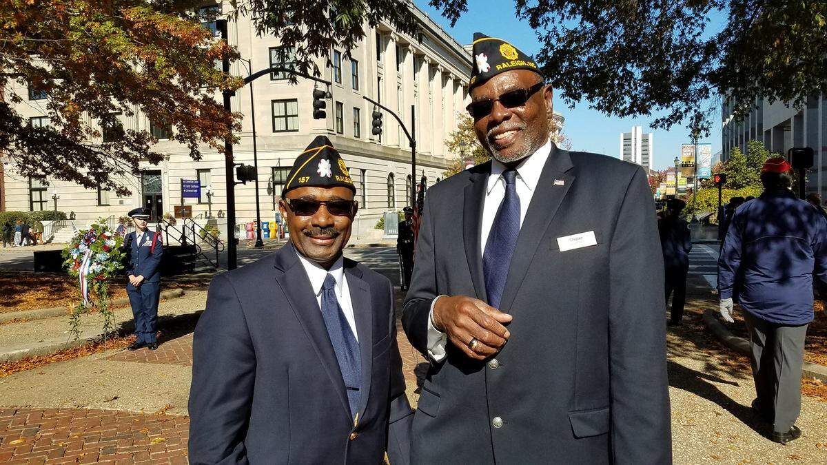 James Whitaker, left, and Willie Pulley are members of American Legion Post 157, named for Charles T. Norwood. Their post marched in the North Carolina Veterans Day Parade on Saturday, Nov. 10, 2018, in downtown Raleigh. Norwood, who lived on Lane Street, was the first African-American soldier to die during World War I. He was wounded hours before an armistice went into effect, ending World War I. Norwood is buried in Raleigh National Cemetery.
