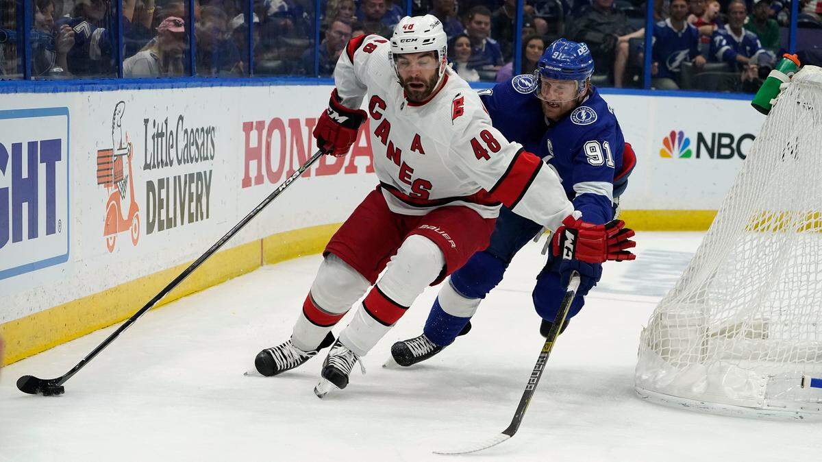 Carolina Hurricanes left wing Jordan Martinook (48) gets ahead of Tampa Bay Lightning center Steven Stamkos (91) during the first period in Game 4 of an NHL hockey Stanley Cup second-round playoff series Saturday, June 5, 2021, in Tampa, Fla. (AP Photo/Chris O’Meara)