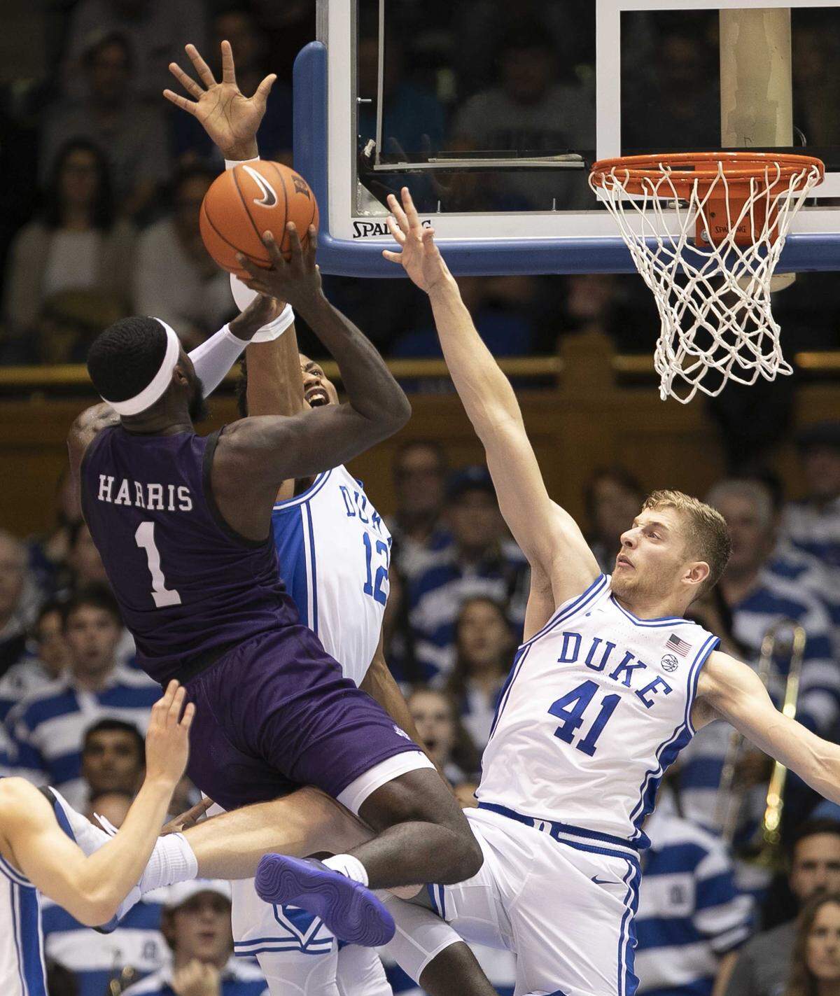 Duke’s Jack White (41) and Javin DeLaurier (12) defend Stephen F. Austin’s Kevon Harris (1) during the second half on Tuesday, November 26, 2019 at Cameron Indoor Stadium in Durham, N.C.