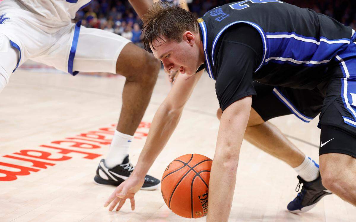 Duke’s Cooper Flagg (2) looses control of the ball and turns it over with five seconds left in the game during Kentucky’s 77-72 victory over Duke in the State Farm Champions Classic in Atlanta, Ga., Tuesday, Nov. 12, 2024.