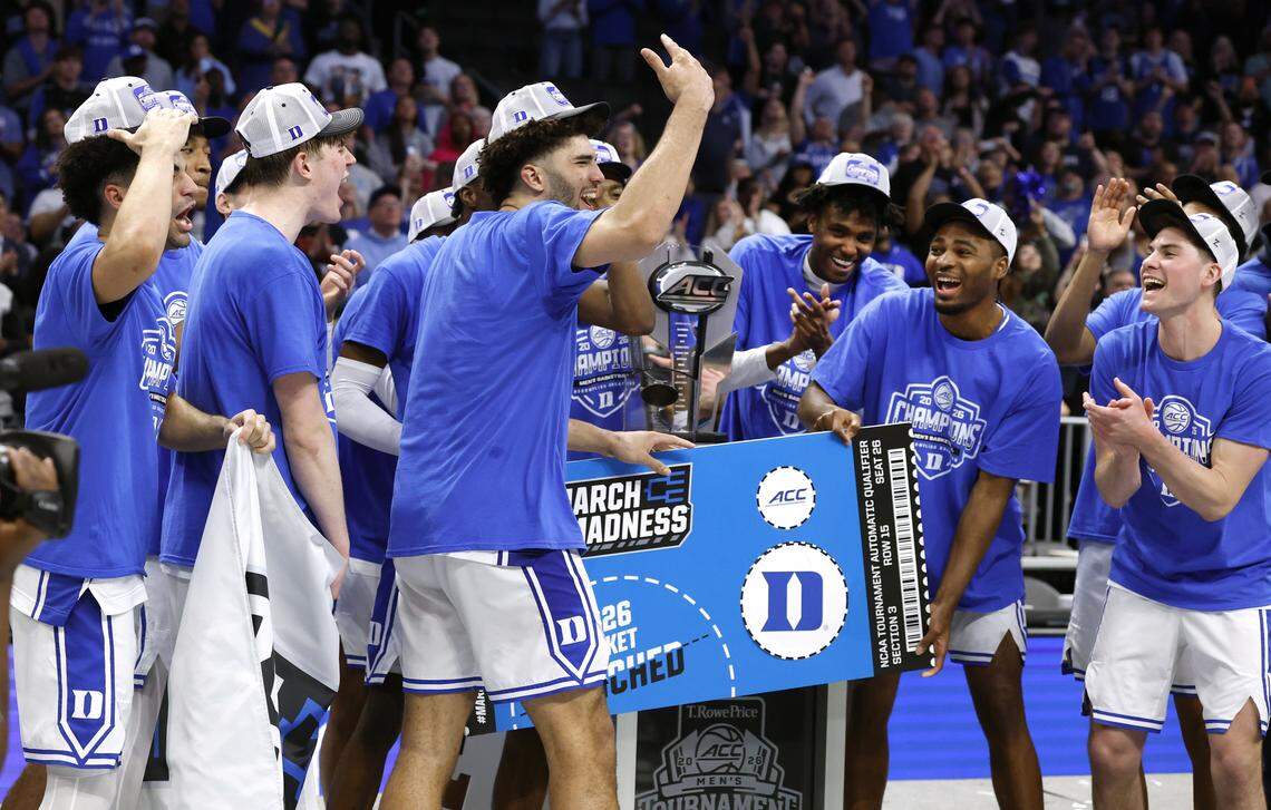 The Duke team celebrates after they “punched their ticket” to the NCAA Tournament after Duke’s 74-70 victory over Virginia in the finals of the 2026 ACC Men’s Basketball Tournament at the Spectrum Center in Charlotte, N.C., Saturday, March 14, 2026.